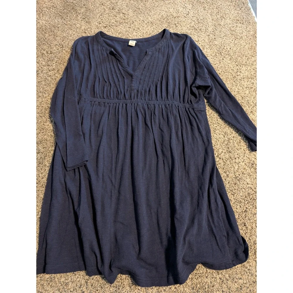old navy pregnancy dresses Maternity V-neck Knit Black Dress Bellies to Bellies slit neck sleeveless ruched sides shirred skirt fitted at top with a full skirt hits at calf model is approx Affordable Pregnancy Dresses That Look